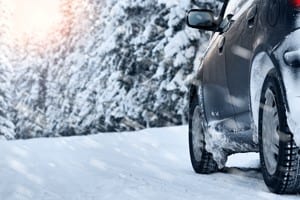 SUV Driving On A Snowy Rural Road Stock Photo