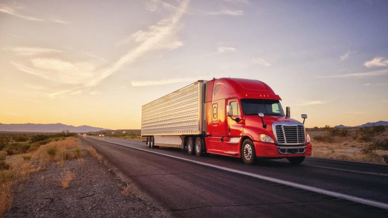 A semi-truck traveling down the highway.