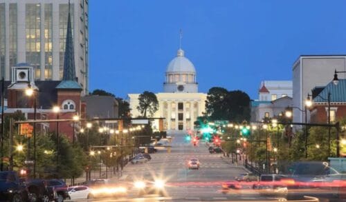 Streetview of traffic in front of state capitol building in Montgomery, Alabama.