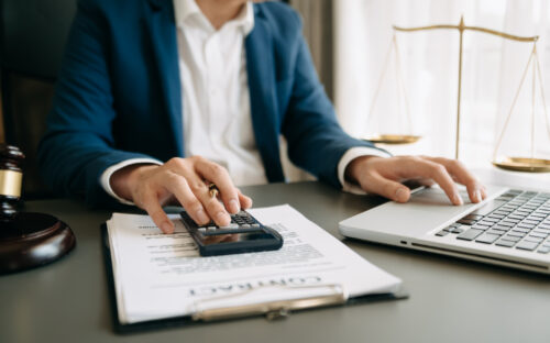A lawyer calculating damages for a personal injury case.