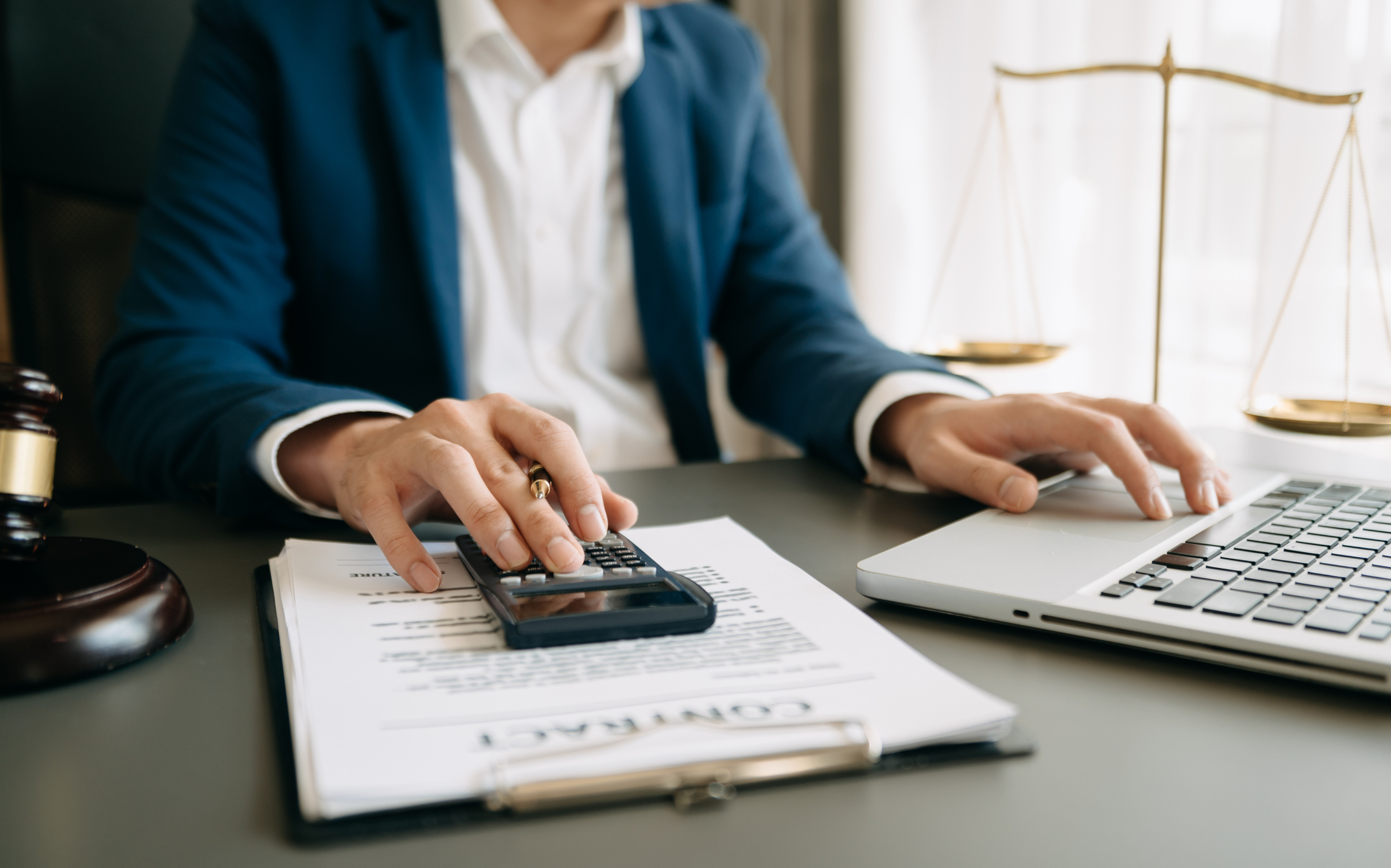 A lawyer calculating damages for a personal injury case.